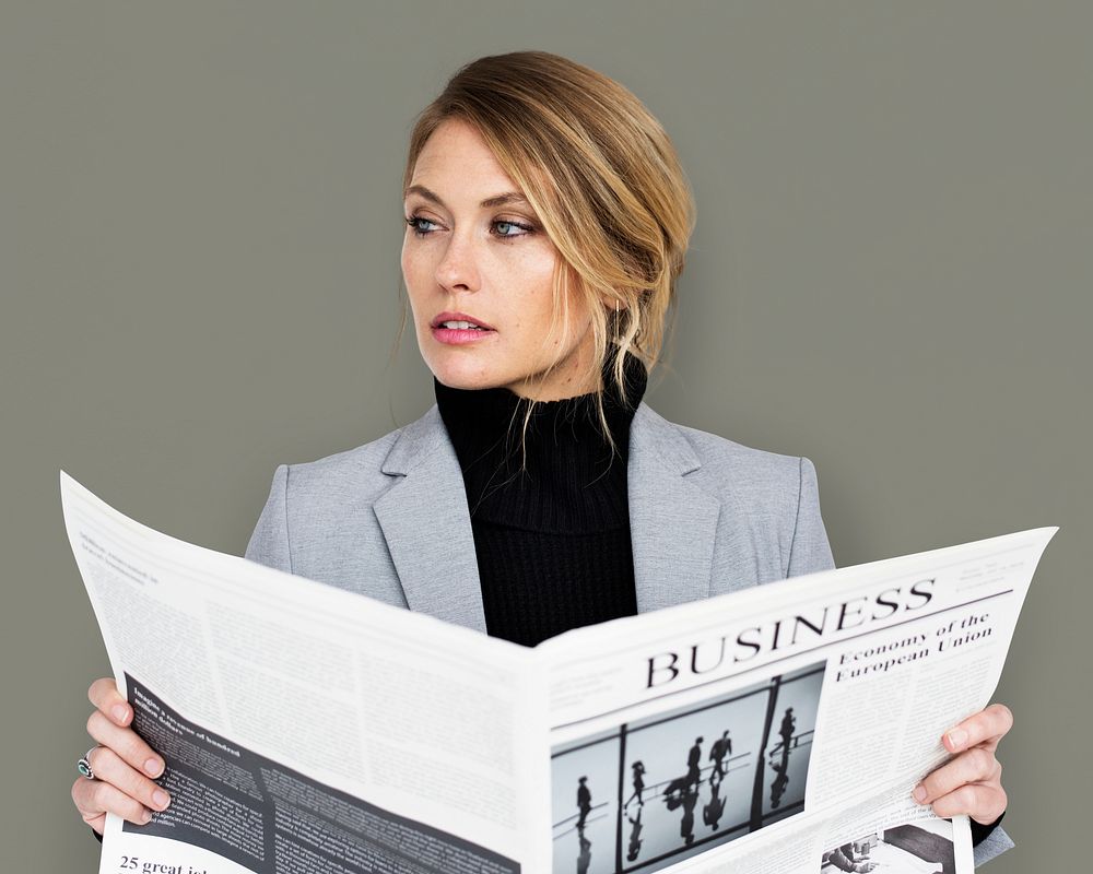 Caucasian Business Woman Reading Newspaper