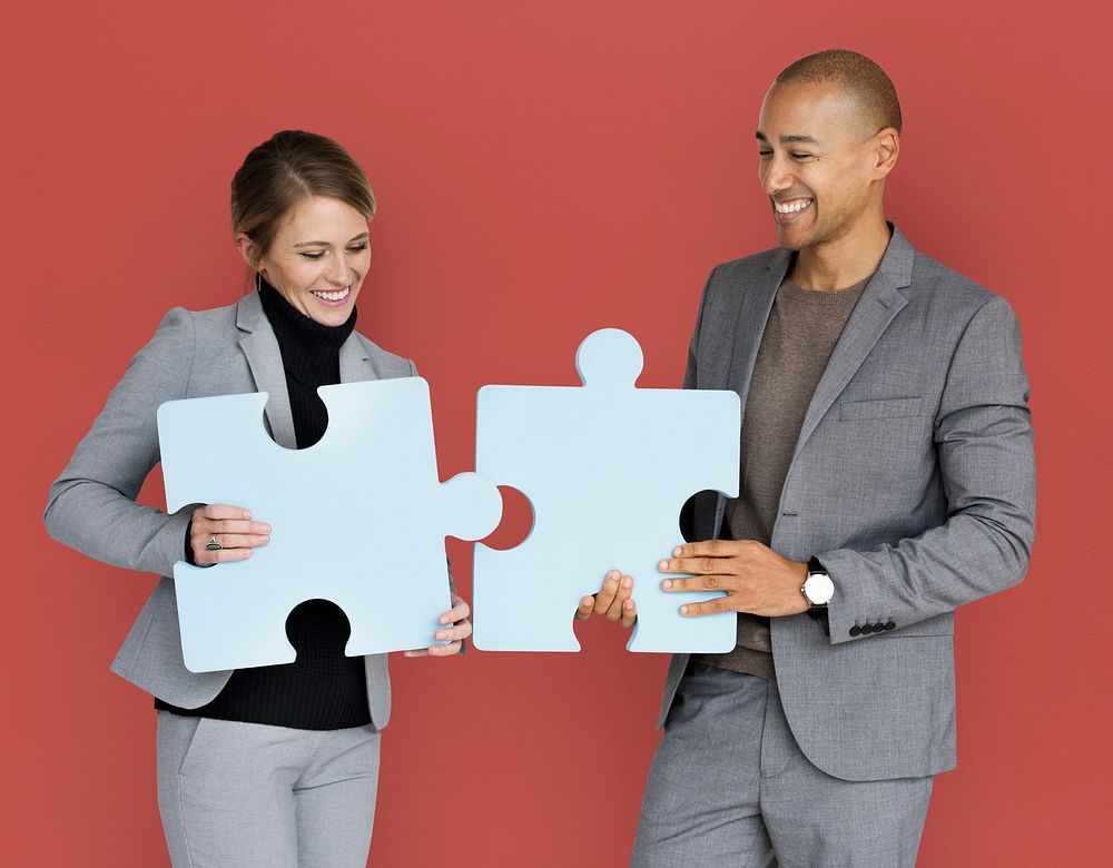 Business People Smiling Happiness Holding Jigsaw Puzzle Concept