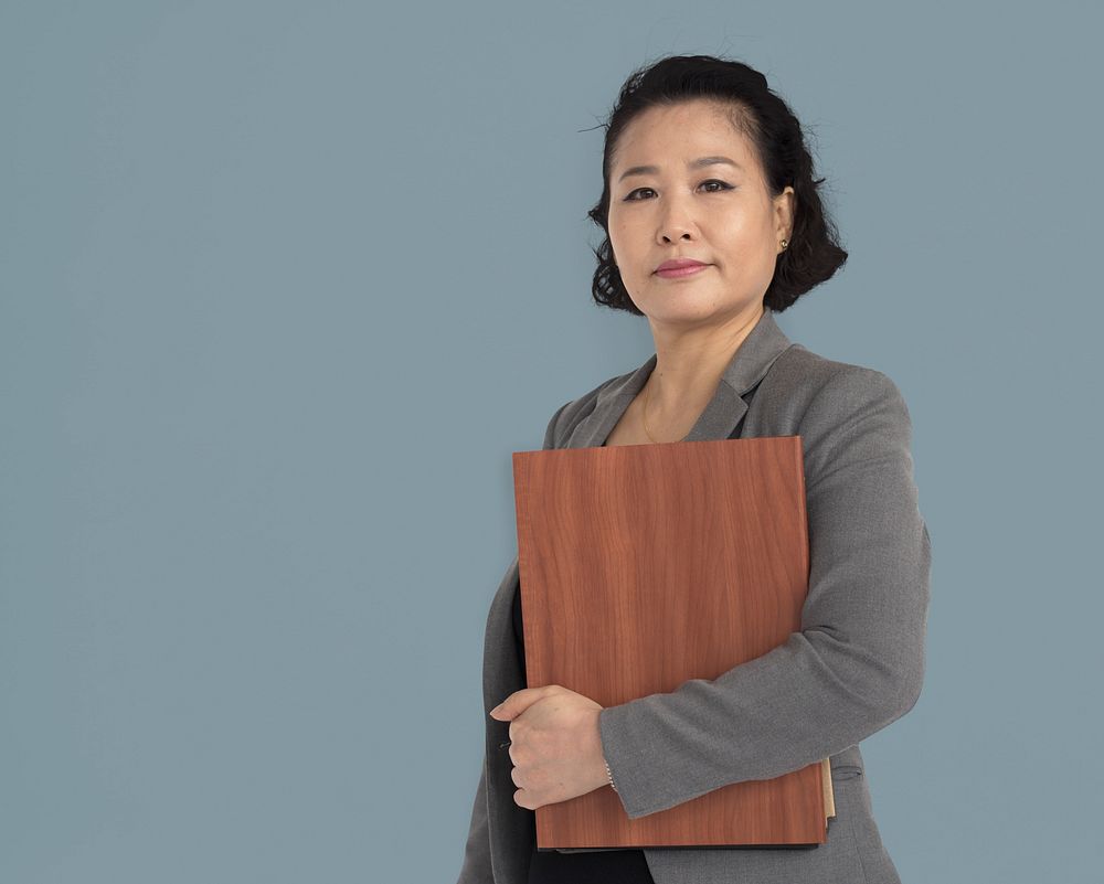 Asian Business Woman Holding Documents