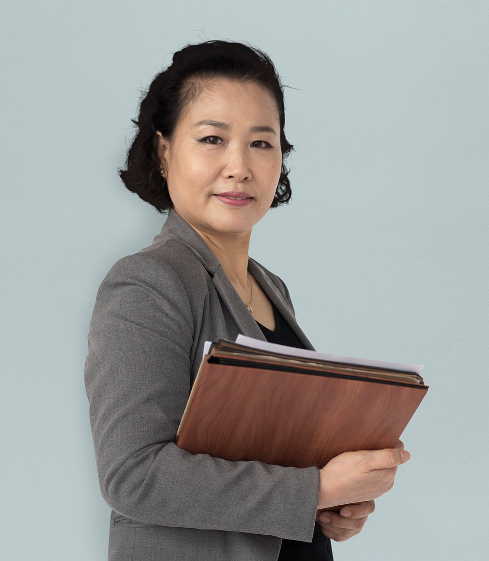 Asian Business Woman Holding Documents