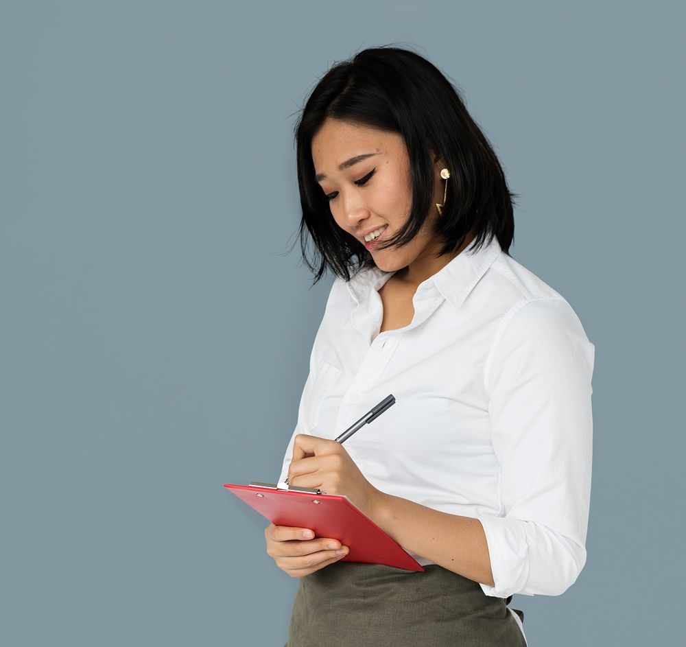 Asian Business Woman Writing Notes