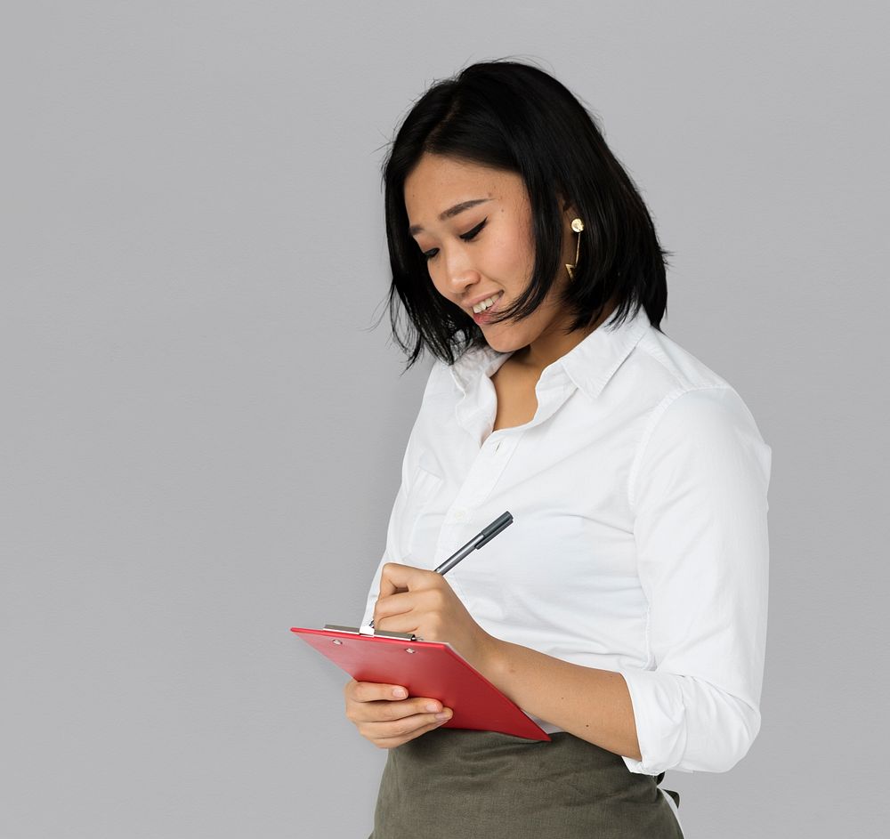 Asian Business Woman Writing Notes