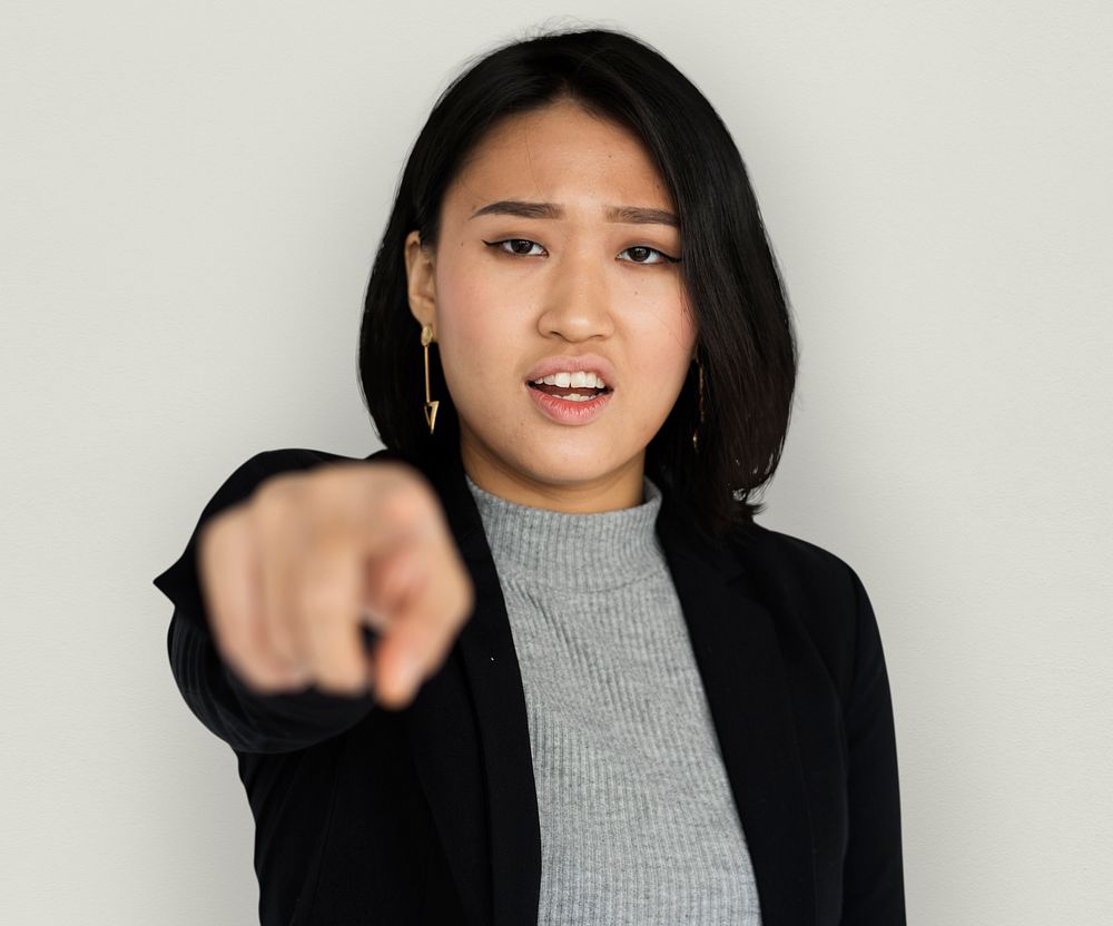 Young Asian Business Woman Pointing Angry