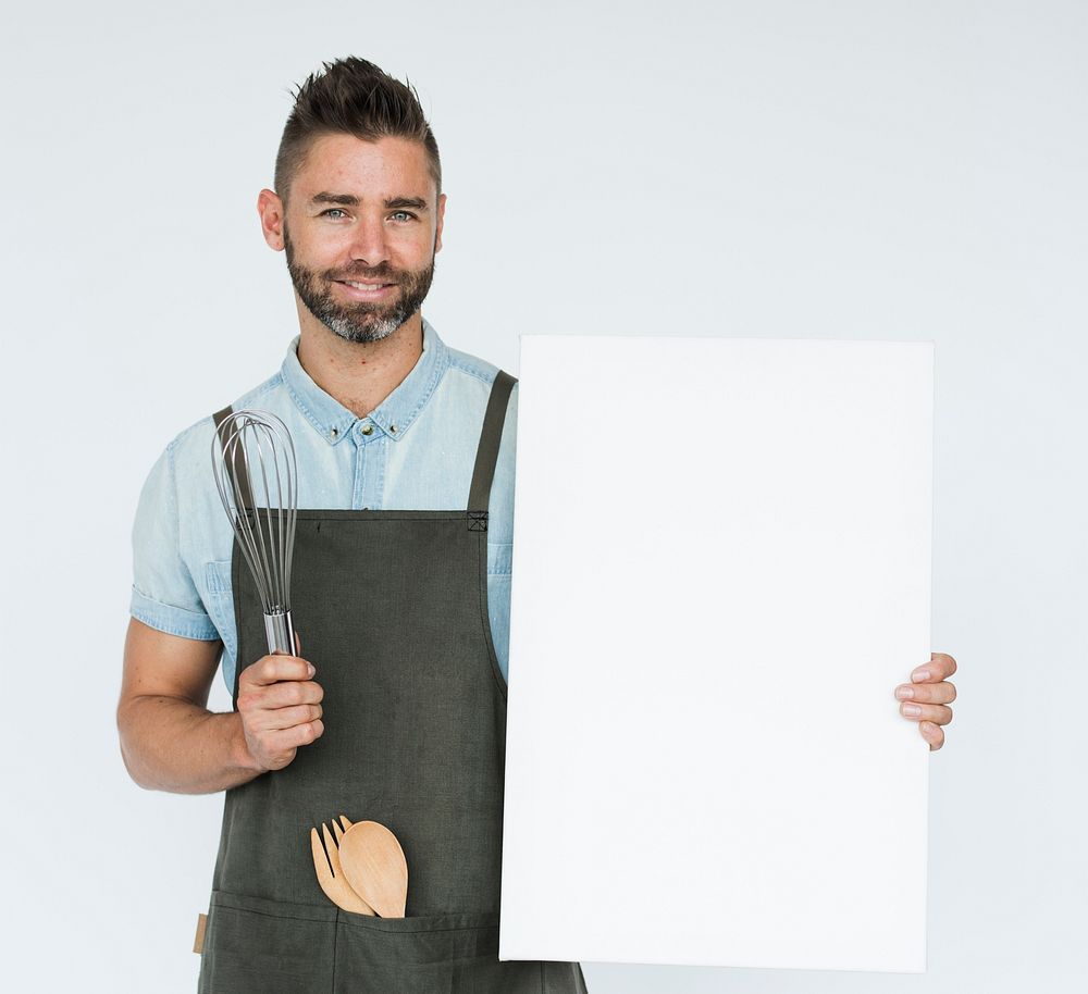 Bearded chef holding a blank placard
