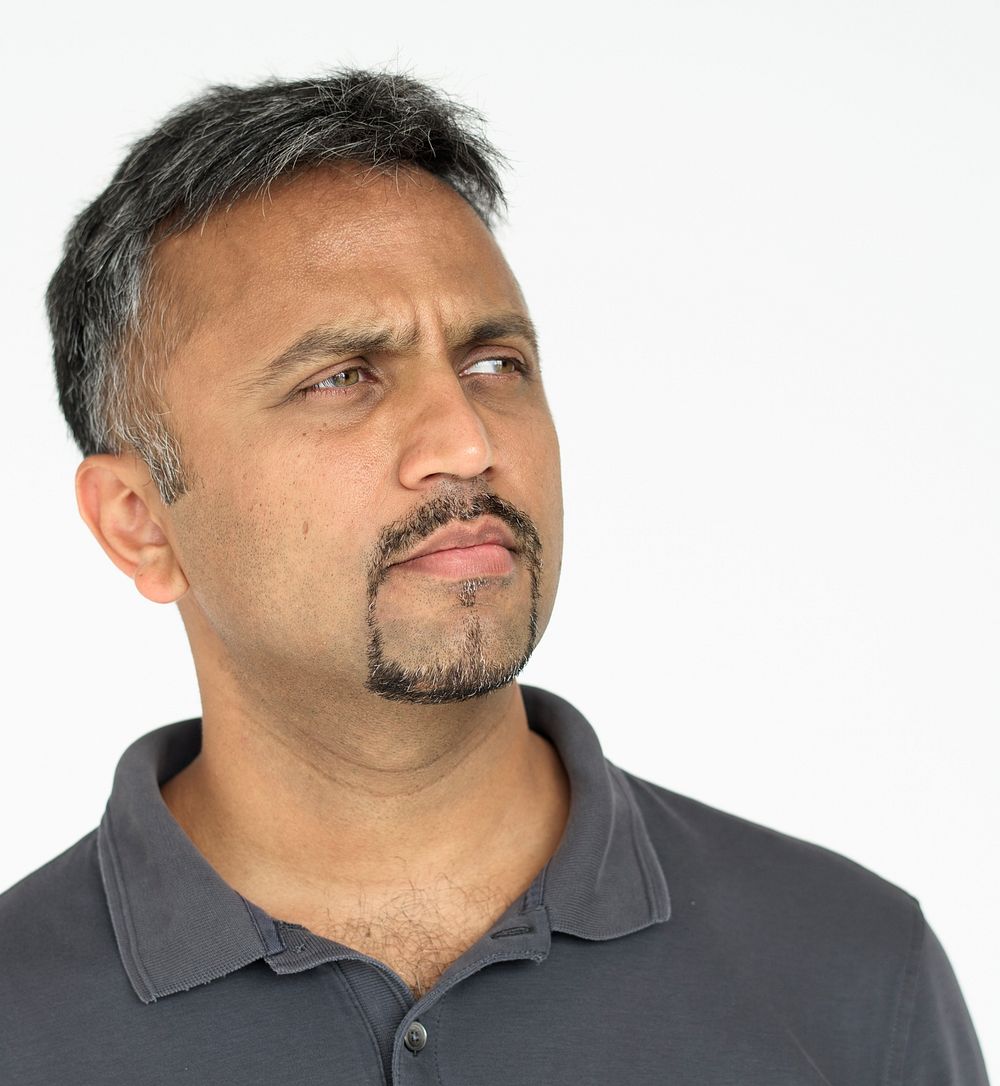 Indian guy thoughtful expression studio portrait