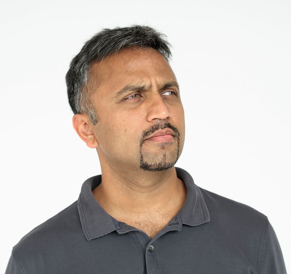 Indian guy thoughtful expression studio portrait