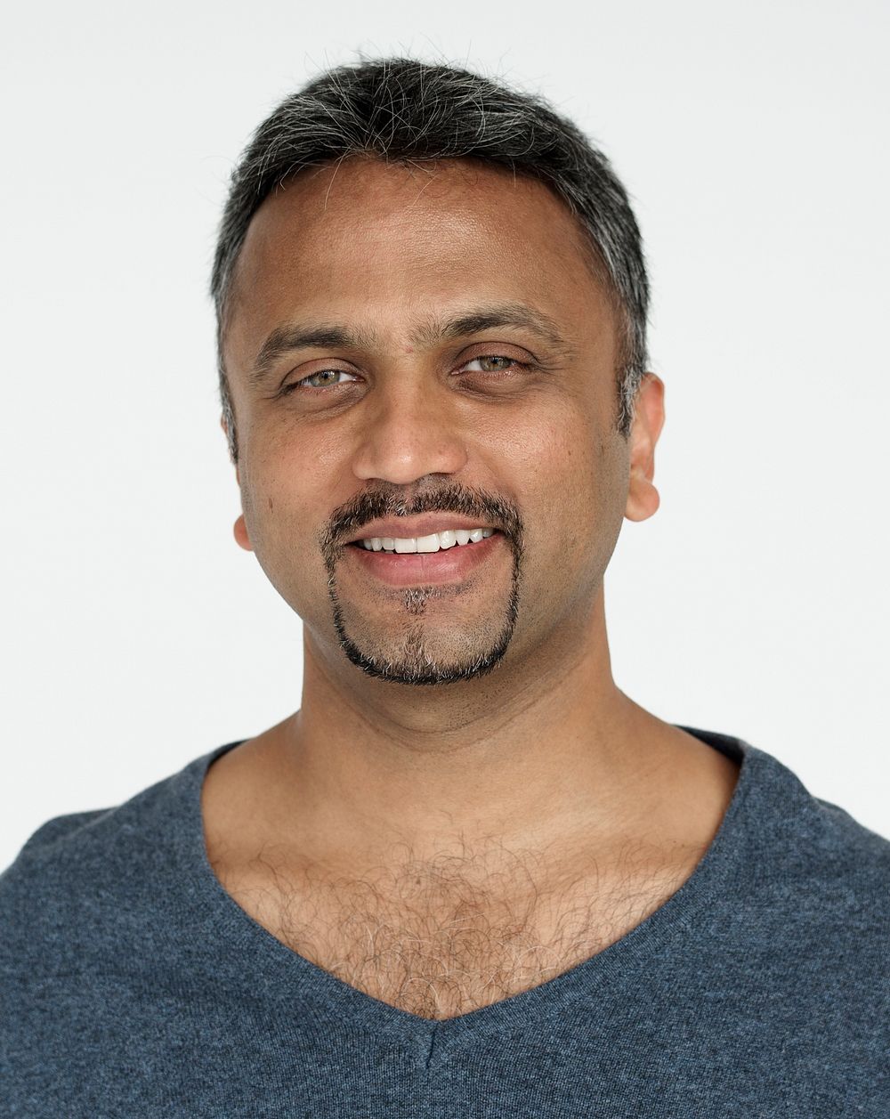 Indian guy smiling cheerful studio portrait