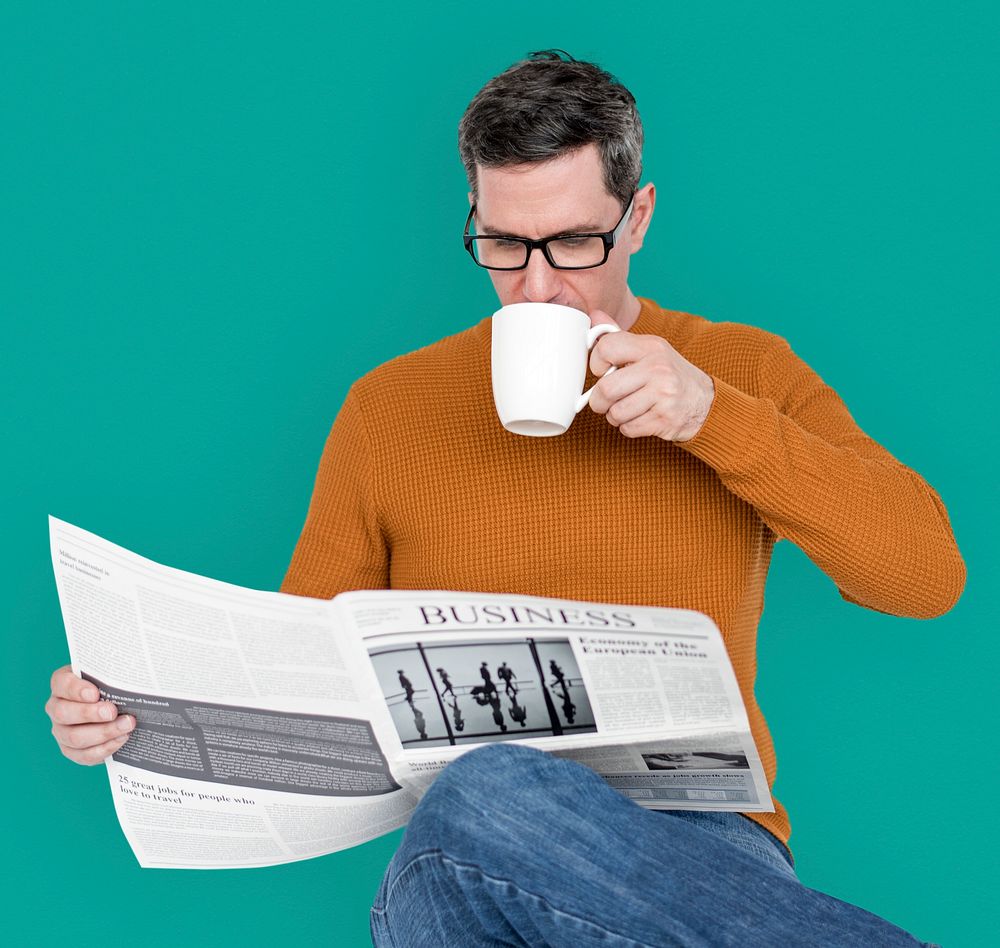 Man Reading Newspaper Information Coffee Drinking