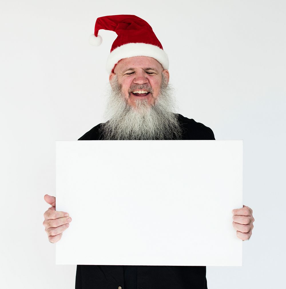 Santa holding a white board