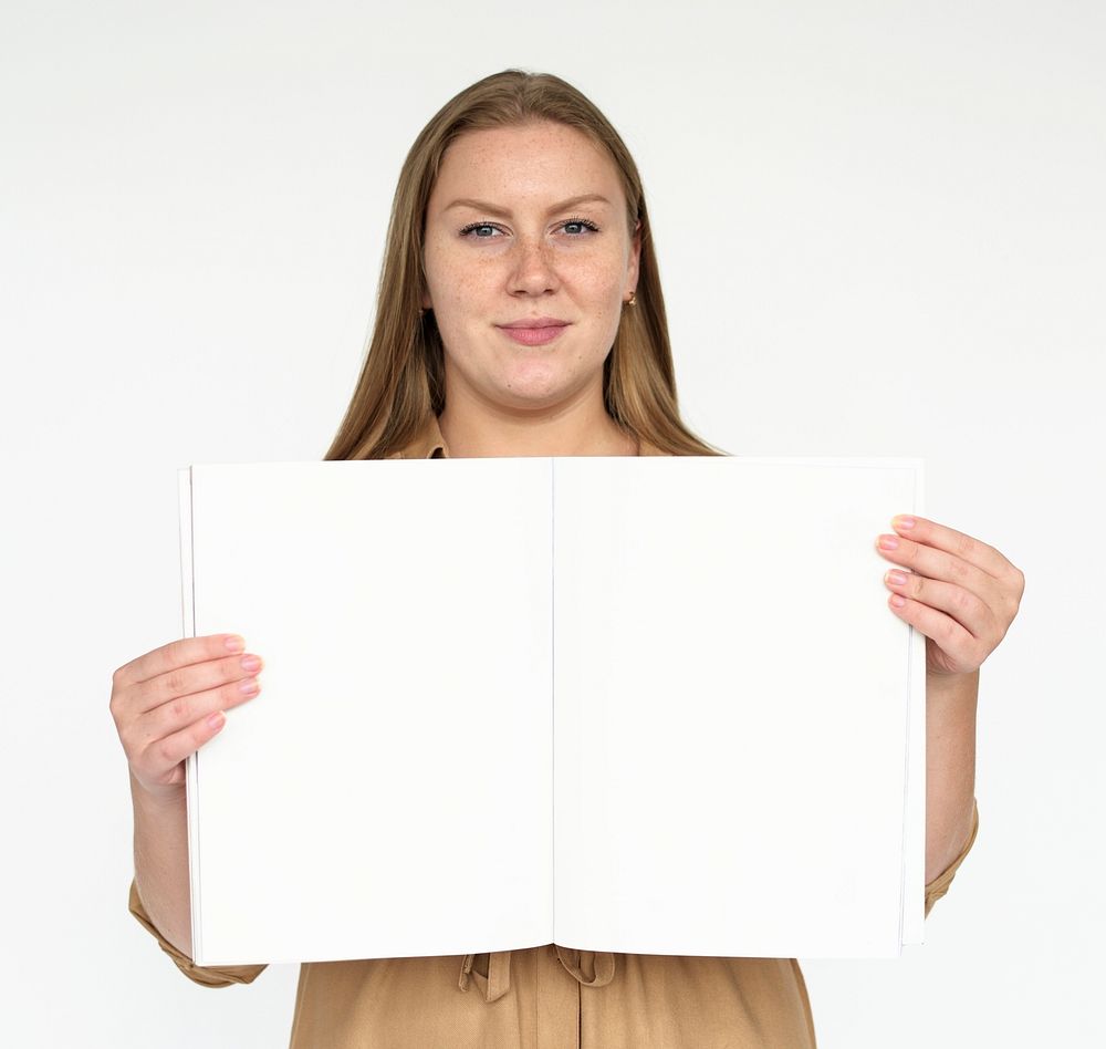 Woman holding a blank book