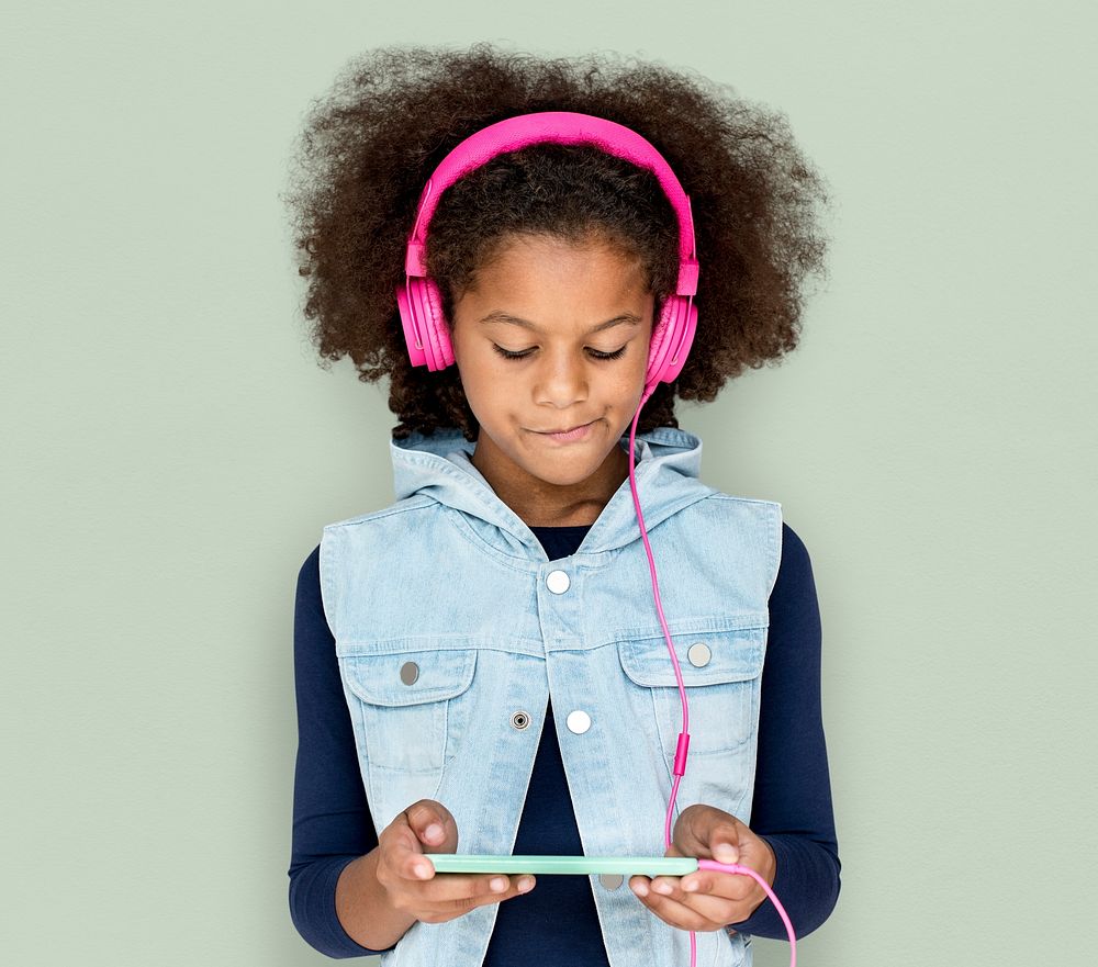 Little Girl Headphones Using Phone