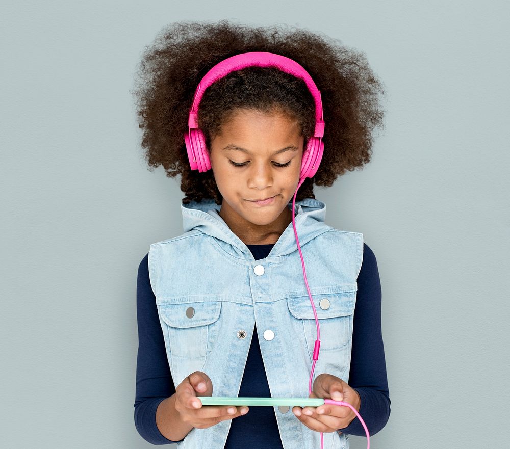 Little Girl Headphones Using Phone