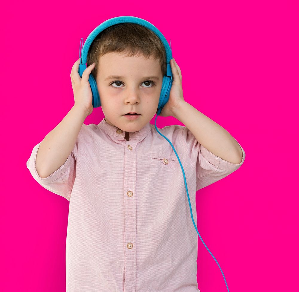 Caucasian Little Boy Trying Headphones