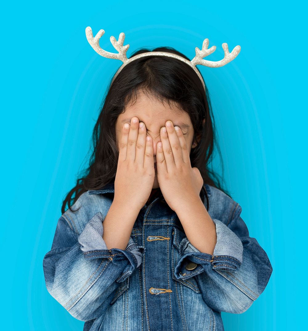 Little Girl Cover Eyes Wearing Reindeer Hairband