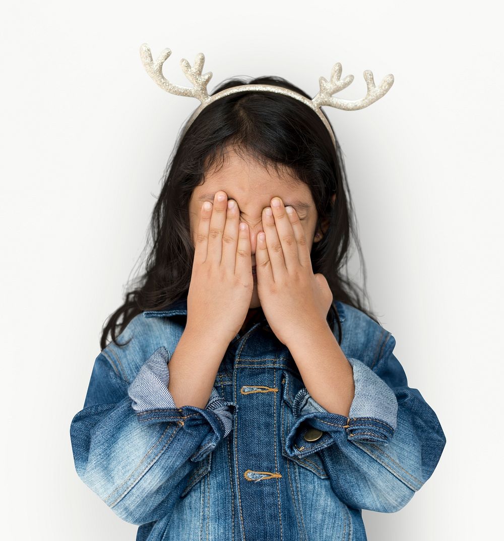 Little Girl Cover Eyes Wearing Reindeer Hairband