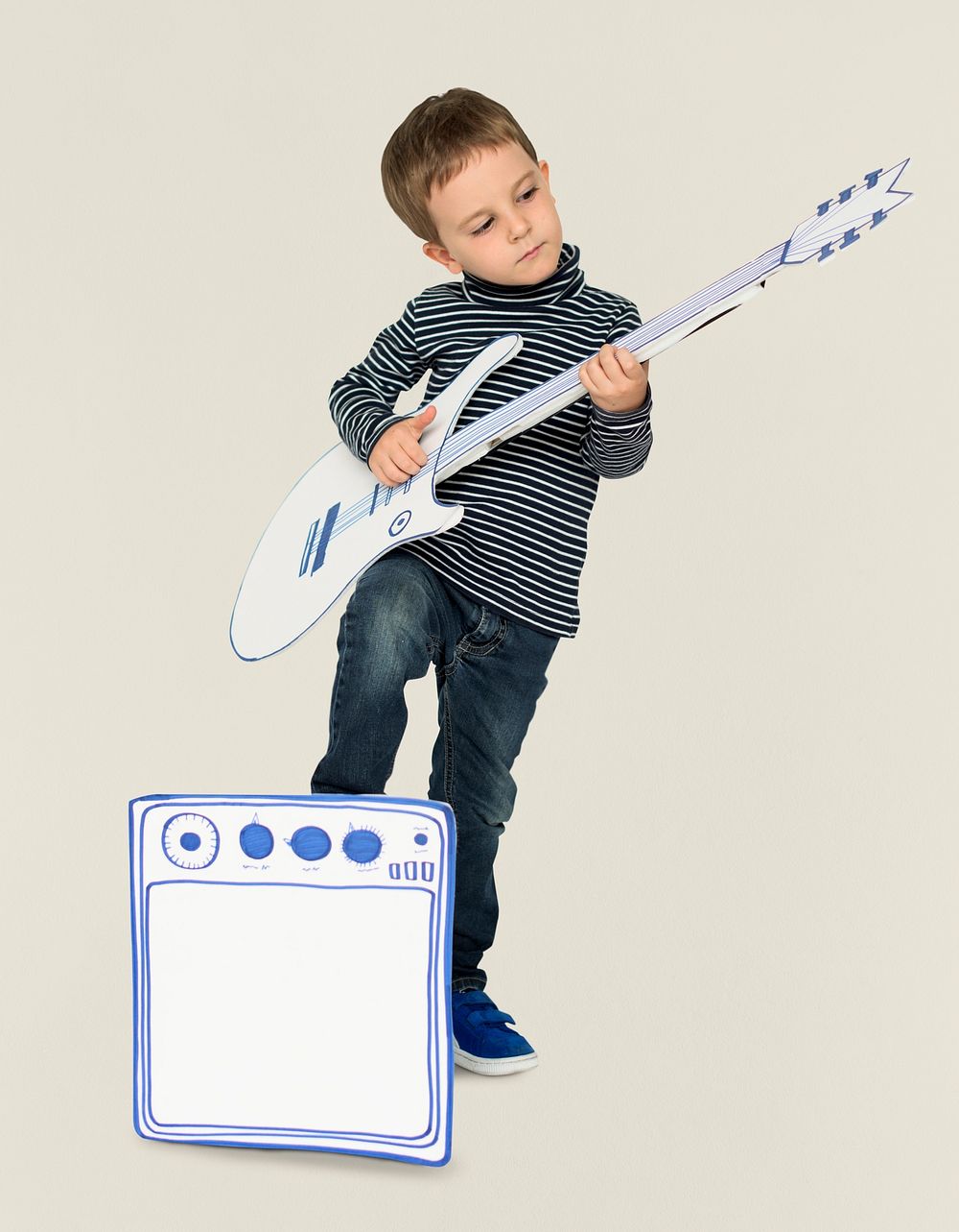 Caucasian Little Boy Playing Papercraft Guitar