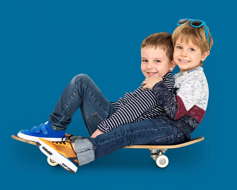 Little Kids Smiling Playing Sitting Skateboard