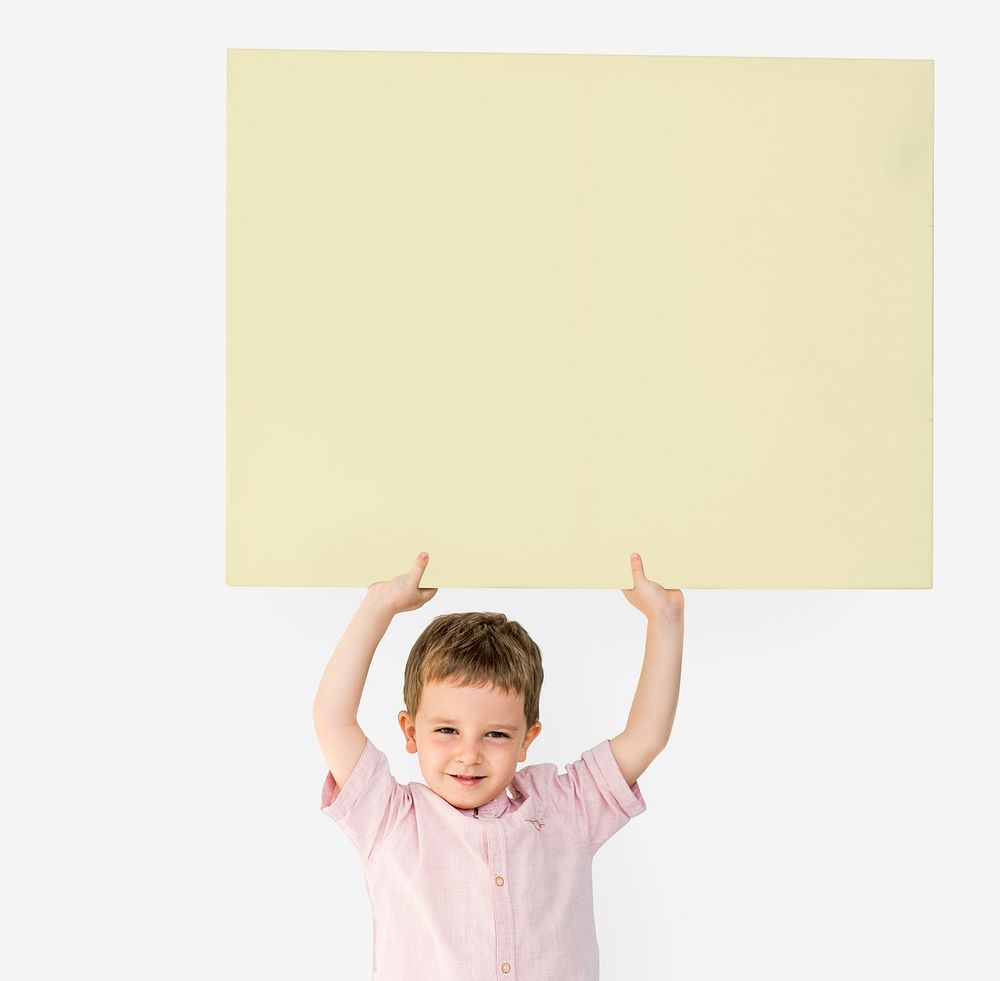 Little Boy Holding Empty Paper Smiling