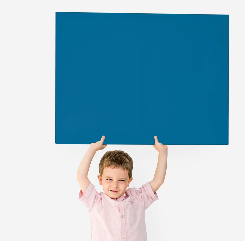 Little Boy Holding Empty Paper Smiling