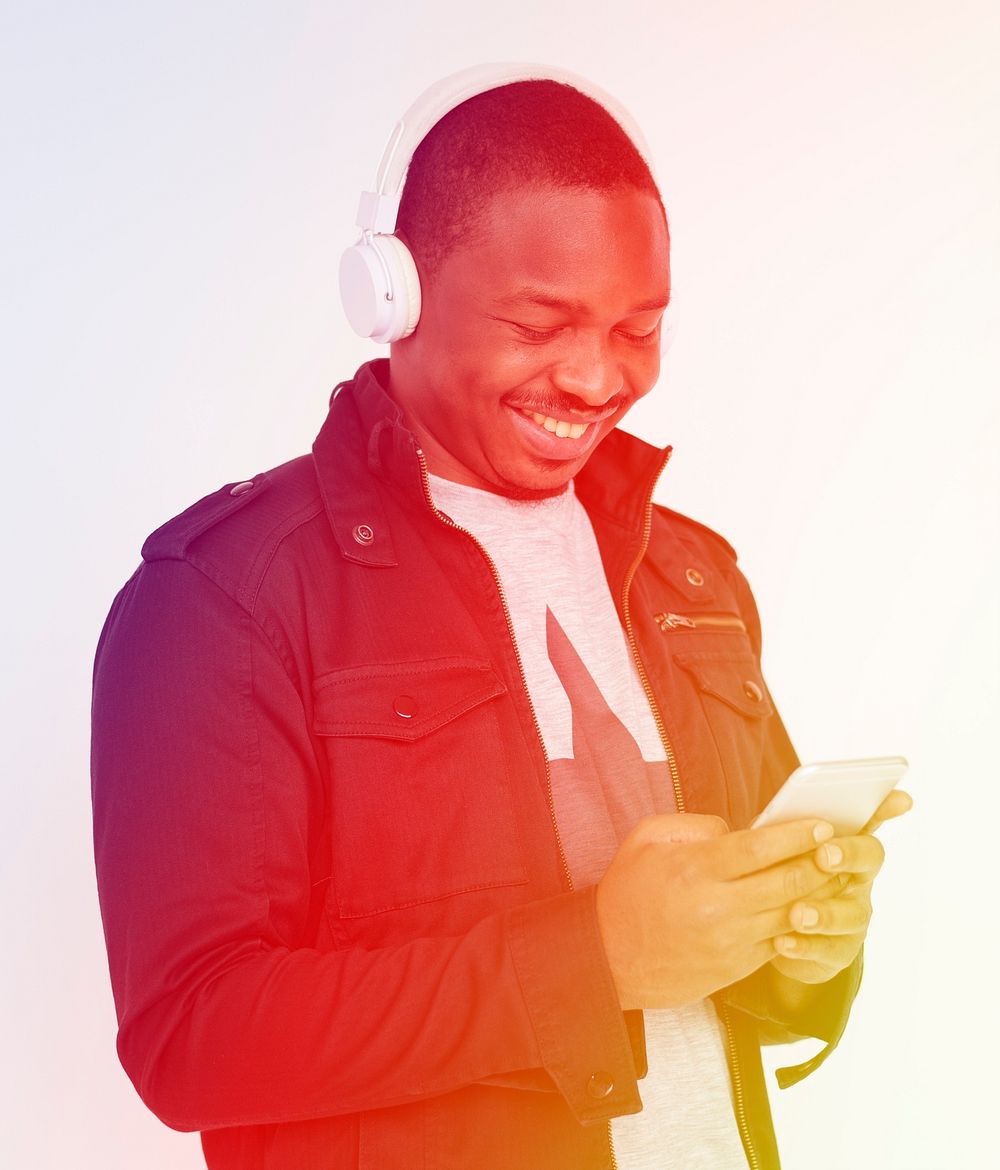 African man listening to music by headphones