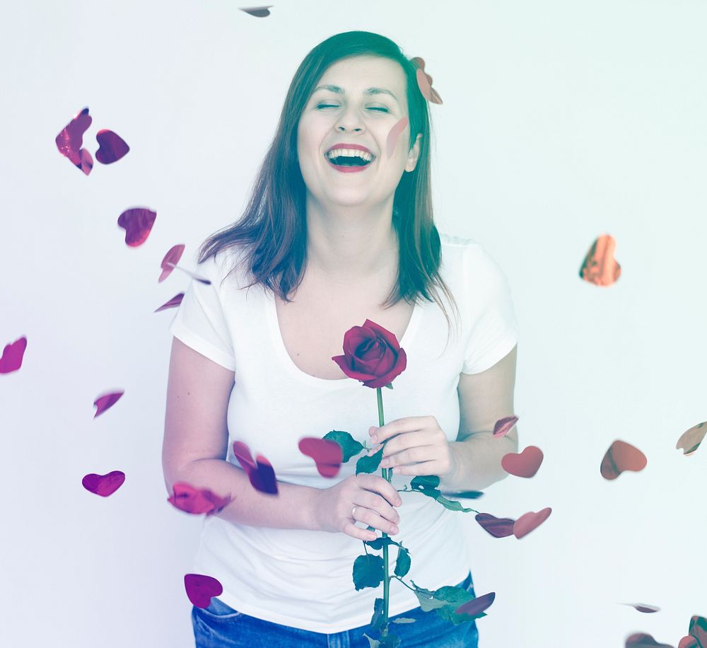 Woman smiling and holding rose romance for valentine