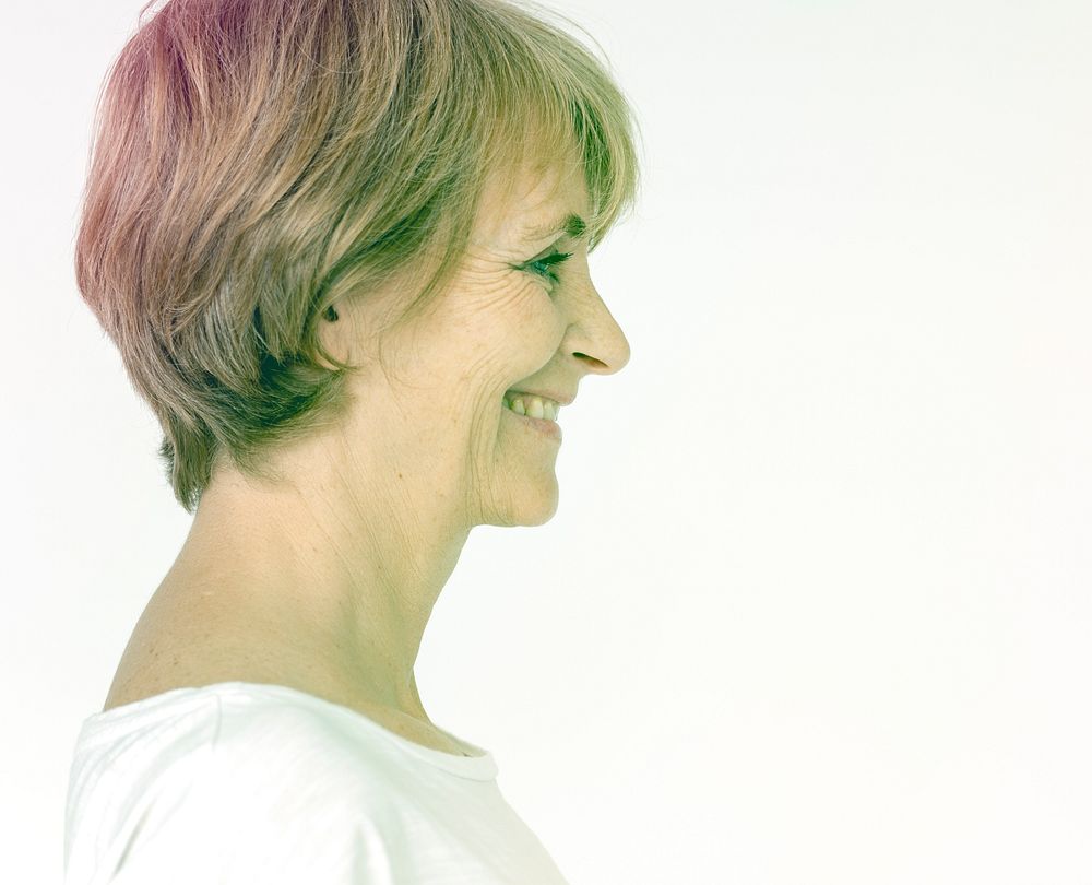 Senior woman smiling with side view
