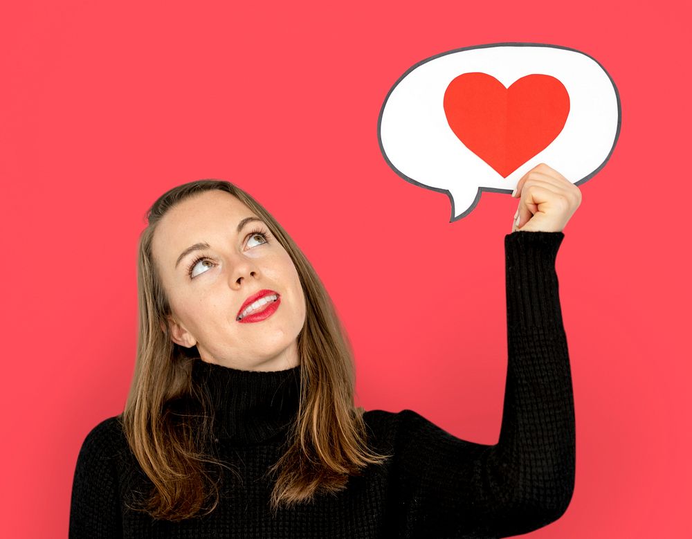 Woman holding speech bubble heart