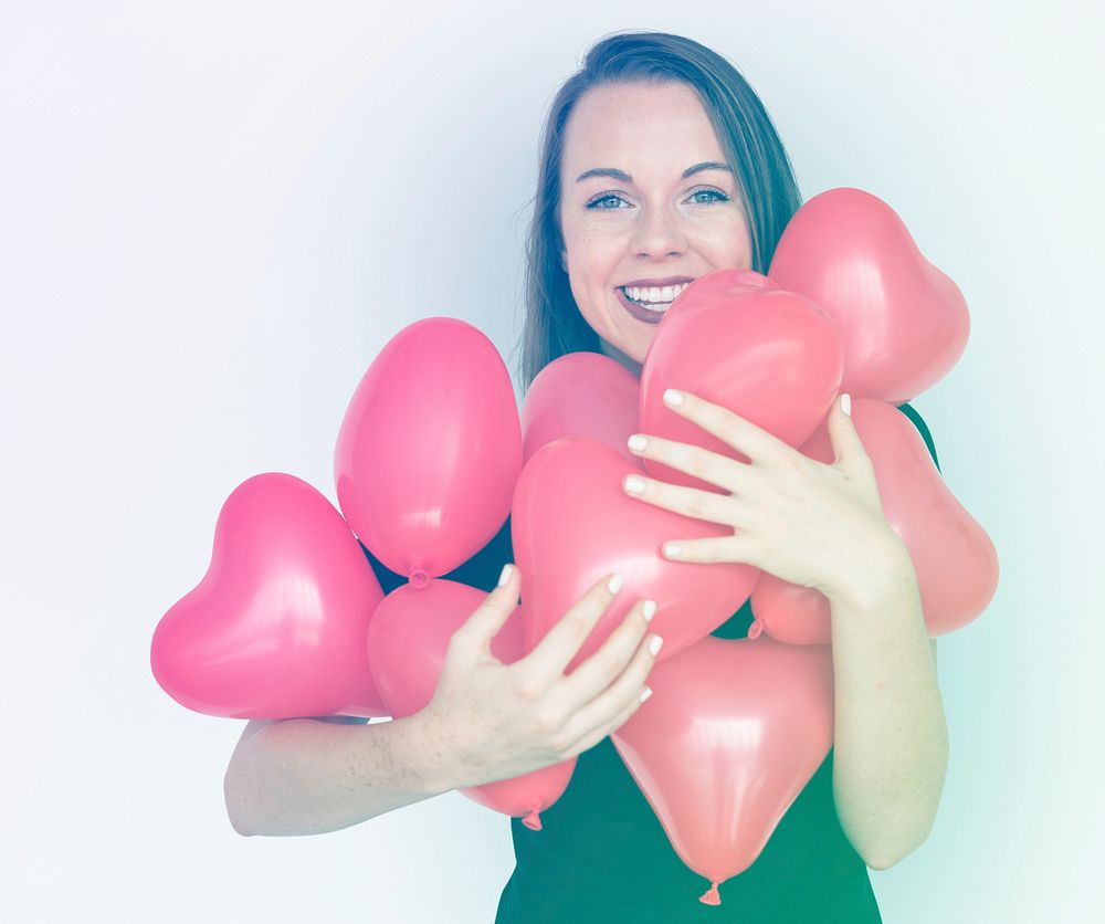 Woman holding balloons for valentine