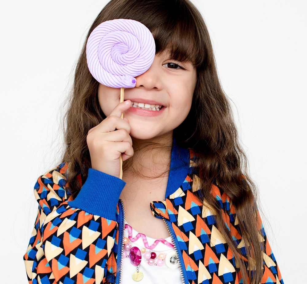 Portrait of Happy girl with lollipop 