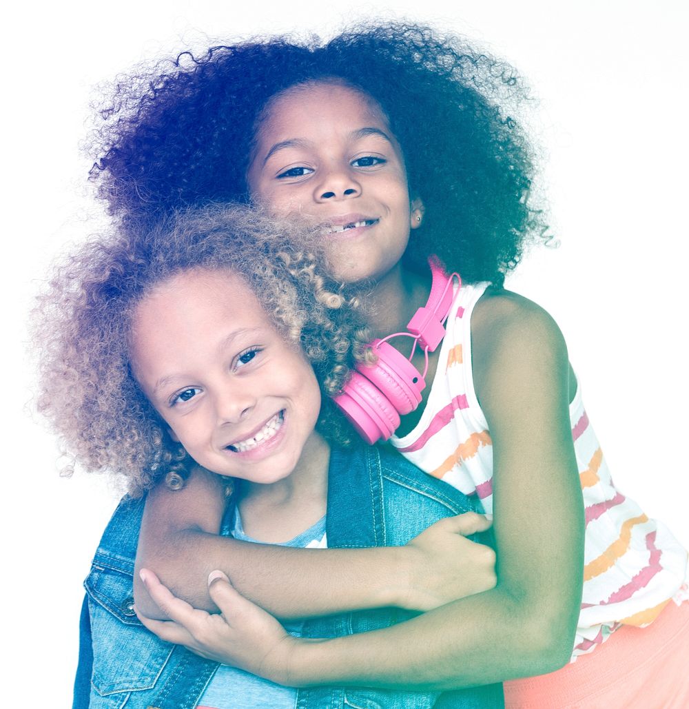 Children standing and smiling and hugging