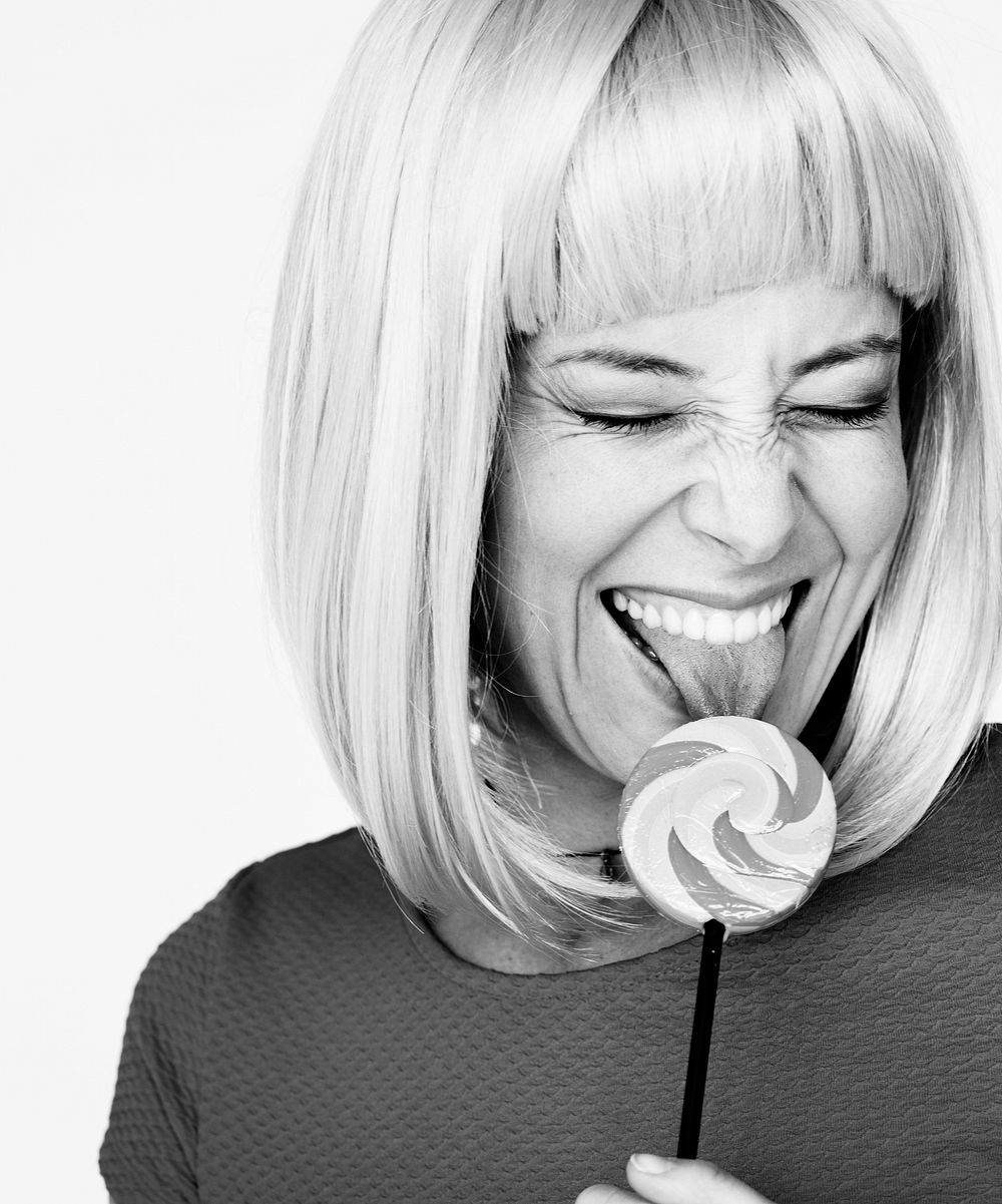 Portrait of a woman with a lollipop