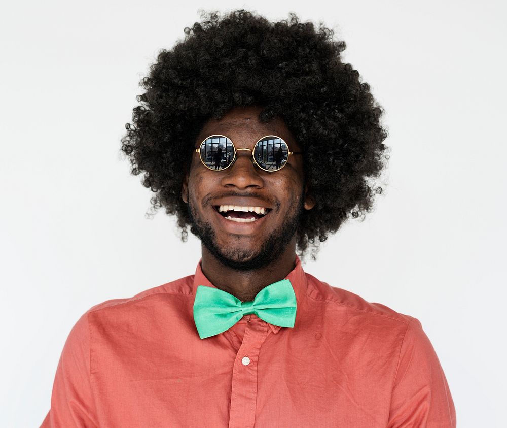 Portrait of a man with an Afro wig and glasses