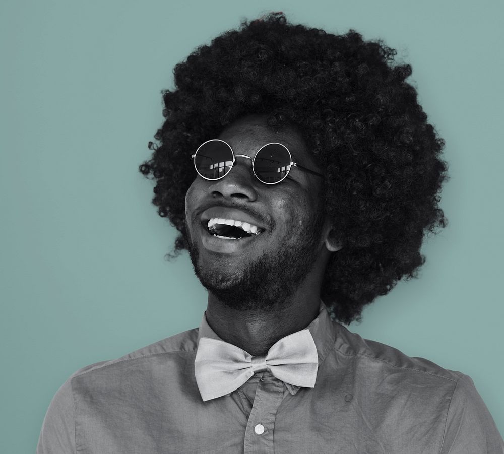 A Guy with a Black Afro Wig Smiling