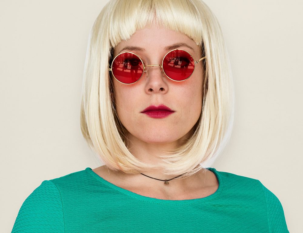 A Girl with a Blonde Wig and Sunglasses Staring