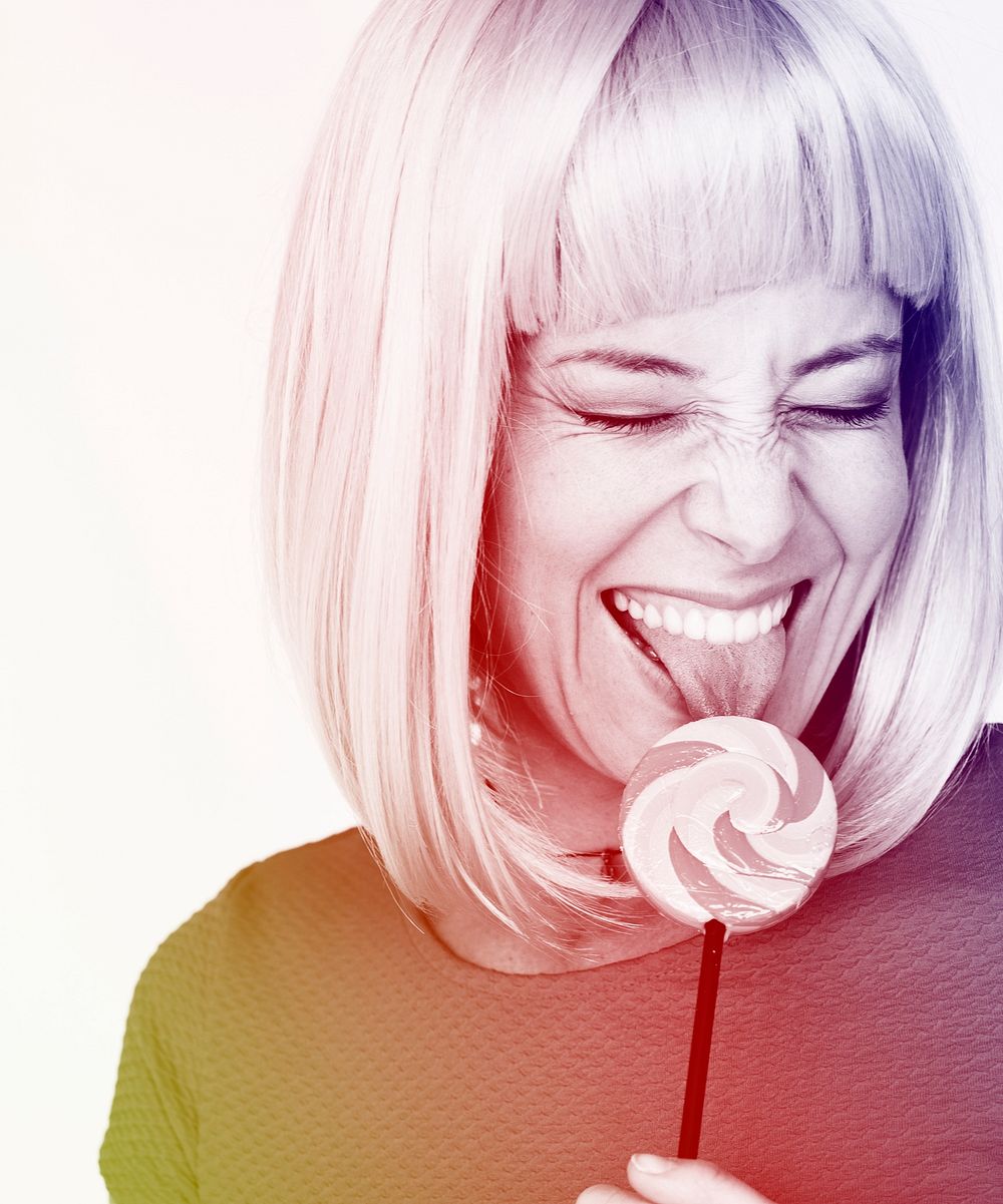 Woman licking a lollipop with feeling