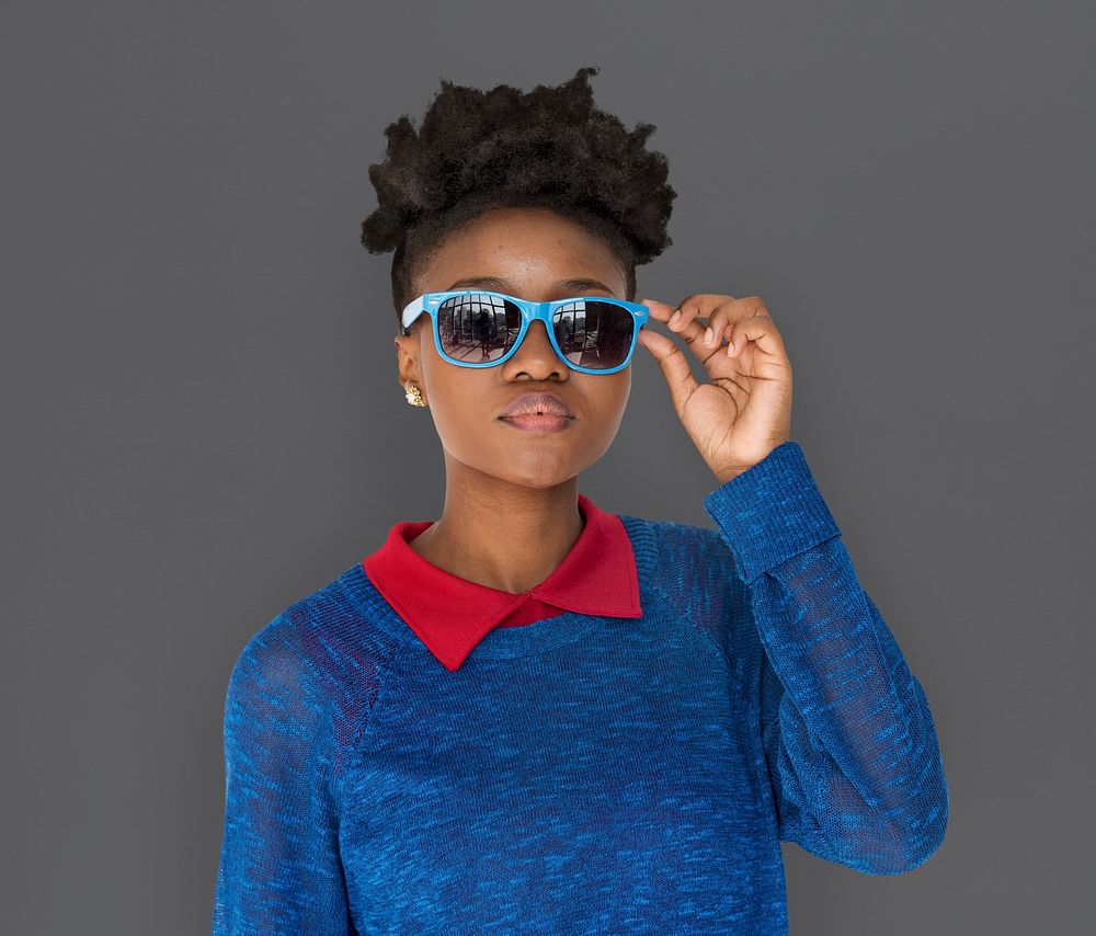 Studio portrait of a young woman wearing shades