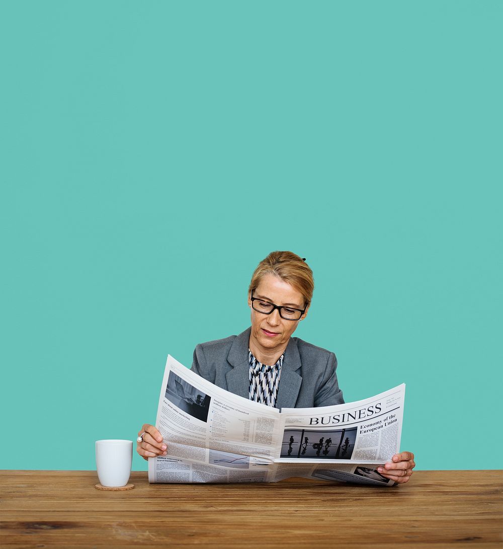 Businesswoman Reading Newspaper Information Coffee Cup