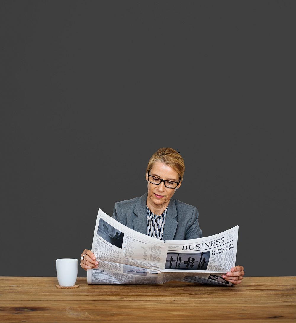Businesswoman Reading Newspaper Information Coffee Cup