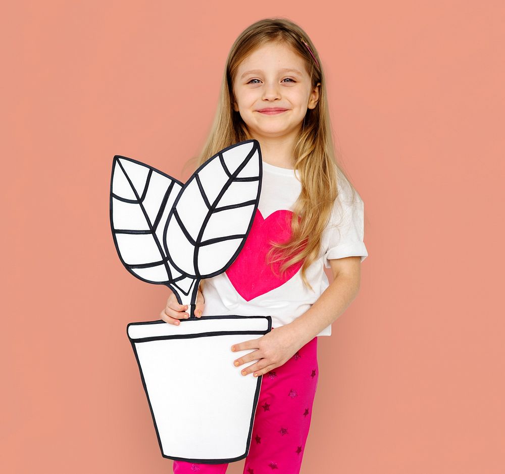 Little Girl Holding Papercraft Plant Smiling