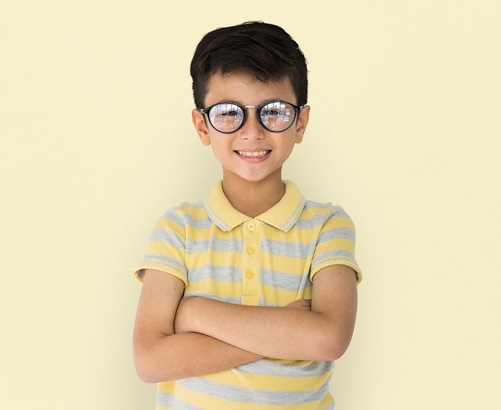 Boy with glasses with arms crossed portrait