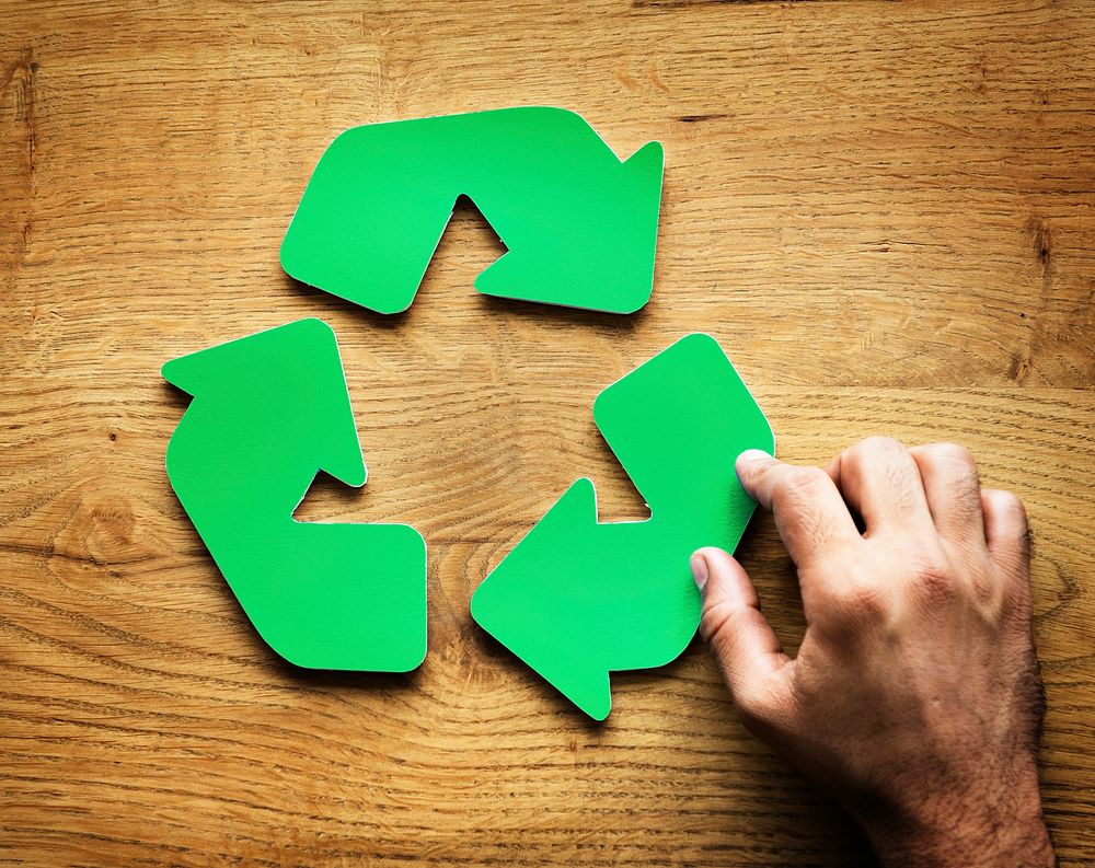 A green recycle symbol