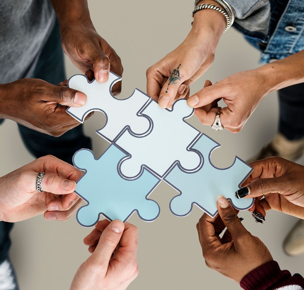 Group of people Holding Paper Jigsaw Puzzle