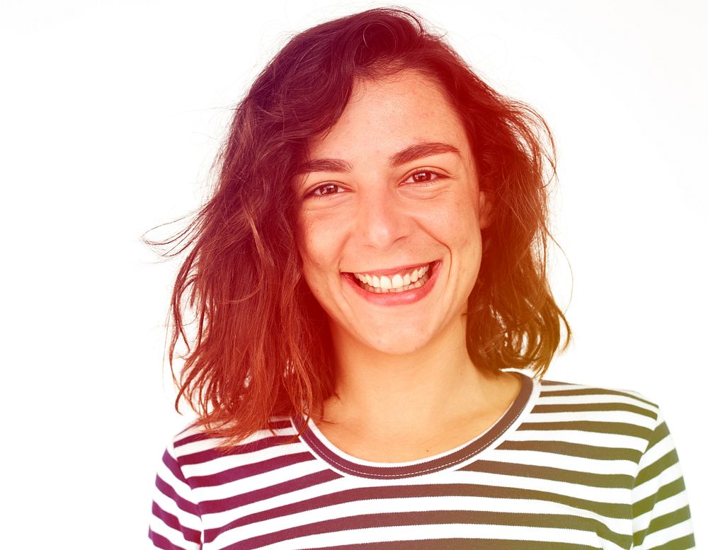 A woman with striped shirt is smiling