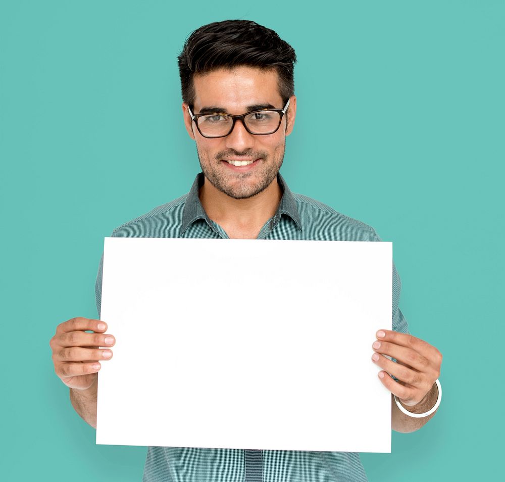 Man in a studio shoot holding placard