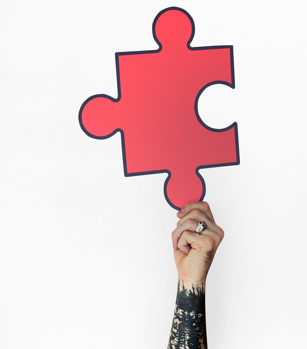 Human Hand Holding Jigsaw Puzzle