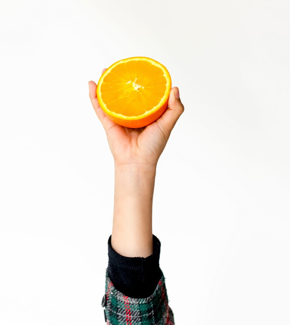 Hand Holding Orange on White Background