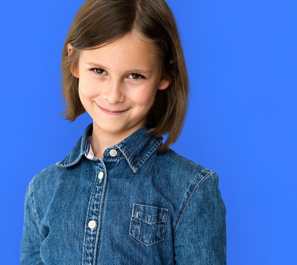 Short haired brunette young girl smiling studio portrait