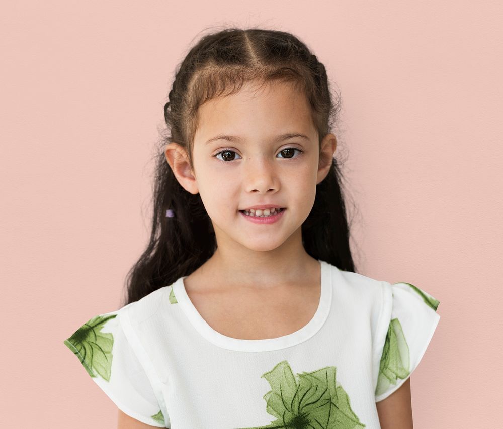 Young little girl with awkward smile expression portrait