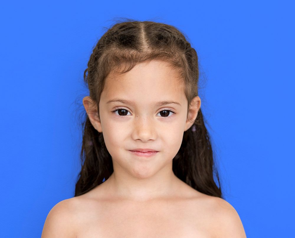 Young asian girl with awkward smile shoulder and head portait