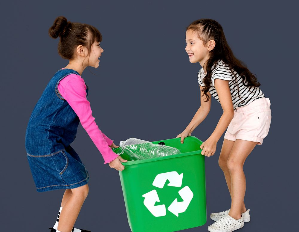 Kids and plastic bottles in a recycle bin